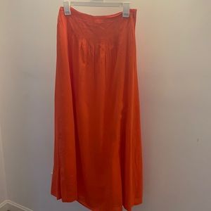 Woman’s orange full length skirt with ribbon waist and zip side